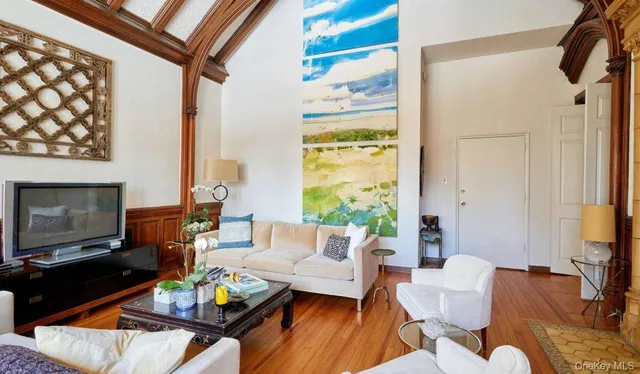 a living room with furniture fireplace and a flat screen tv