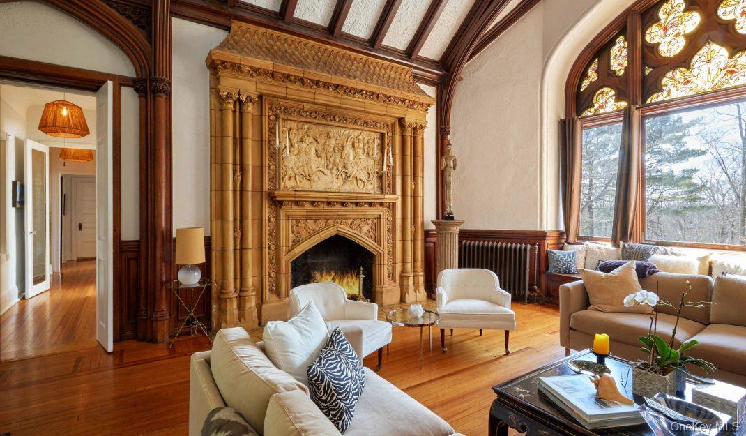61 Crows Nest Road, Unit 6 Tuxedo Park, NY 10987 - Photo 8 of 14 a living room with furniture fireplace and a large window