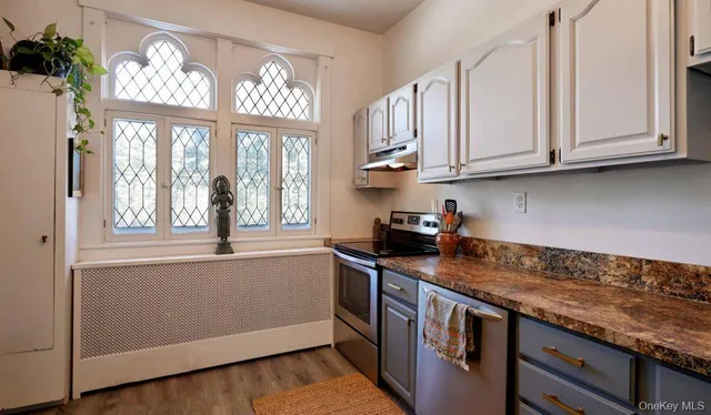a kitchen with stainless steel appliances granite countertop cabinets and a granite counter tops