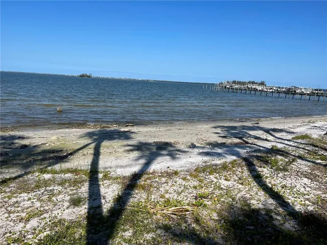 a view of swimming pool with a table and chairs
