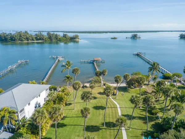 an aerial view of a house with a lake view