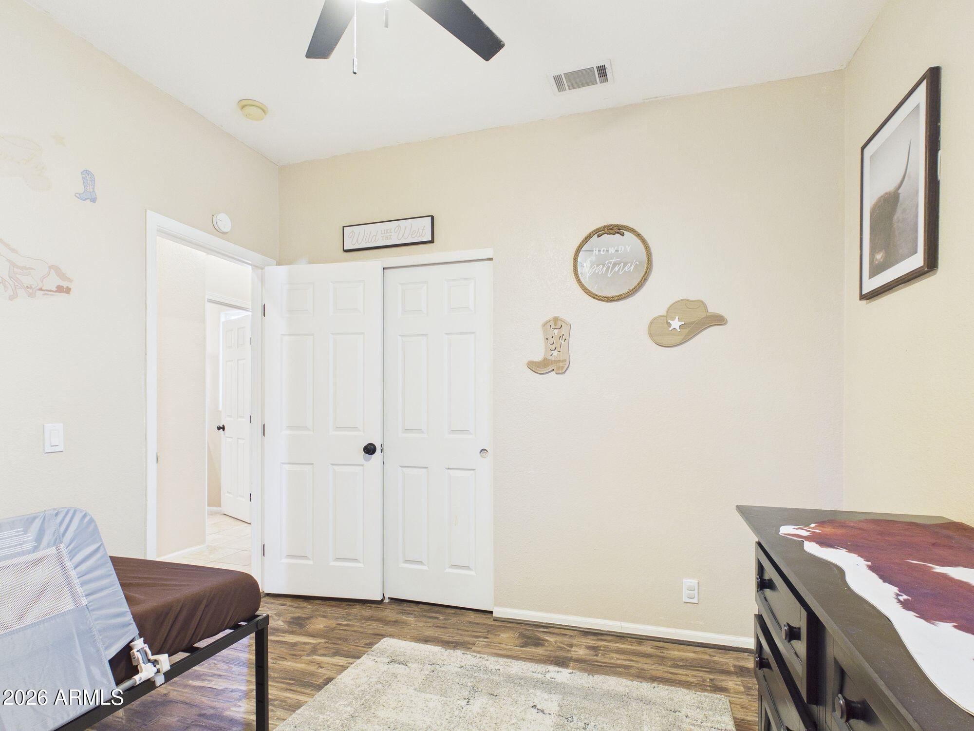 51491 West Dune Shadow Road Maricopa, AZ 85139 - Photo 17 of 33 a view of a room with racks on the wall