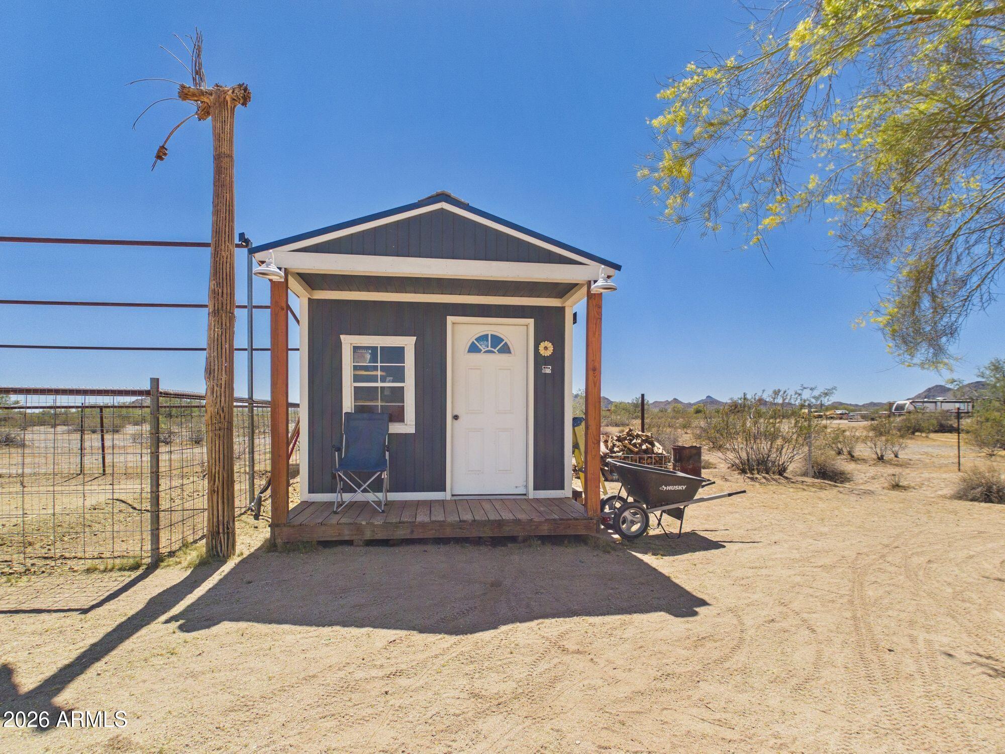 51491 West Dune Shadow Road Maricopa, AZ 85139 - Photo 26 of 33 a front view of a house with a yard