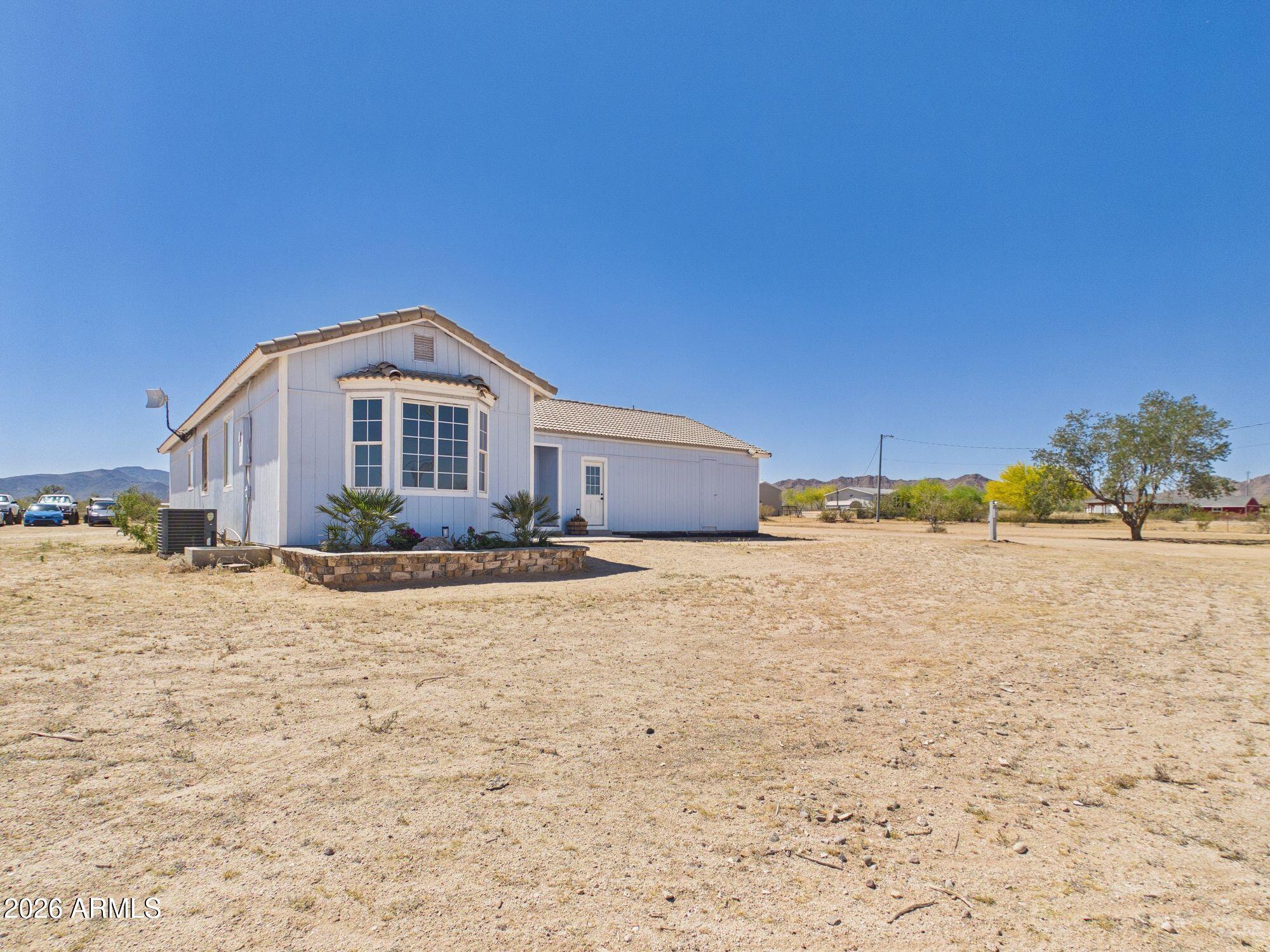51491 West Dune Shadow Road Maricopa, AZ 85139 - Photo 32 of 33 a view of a house with a yard