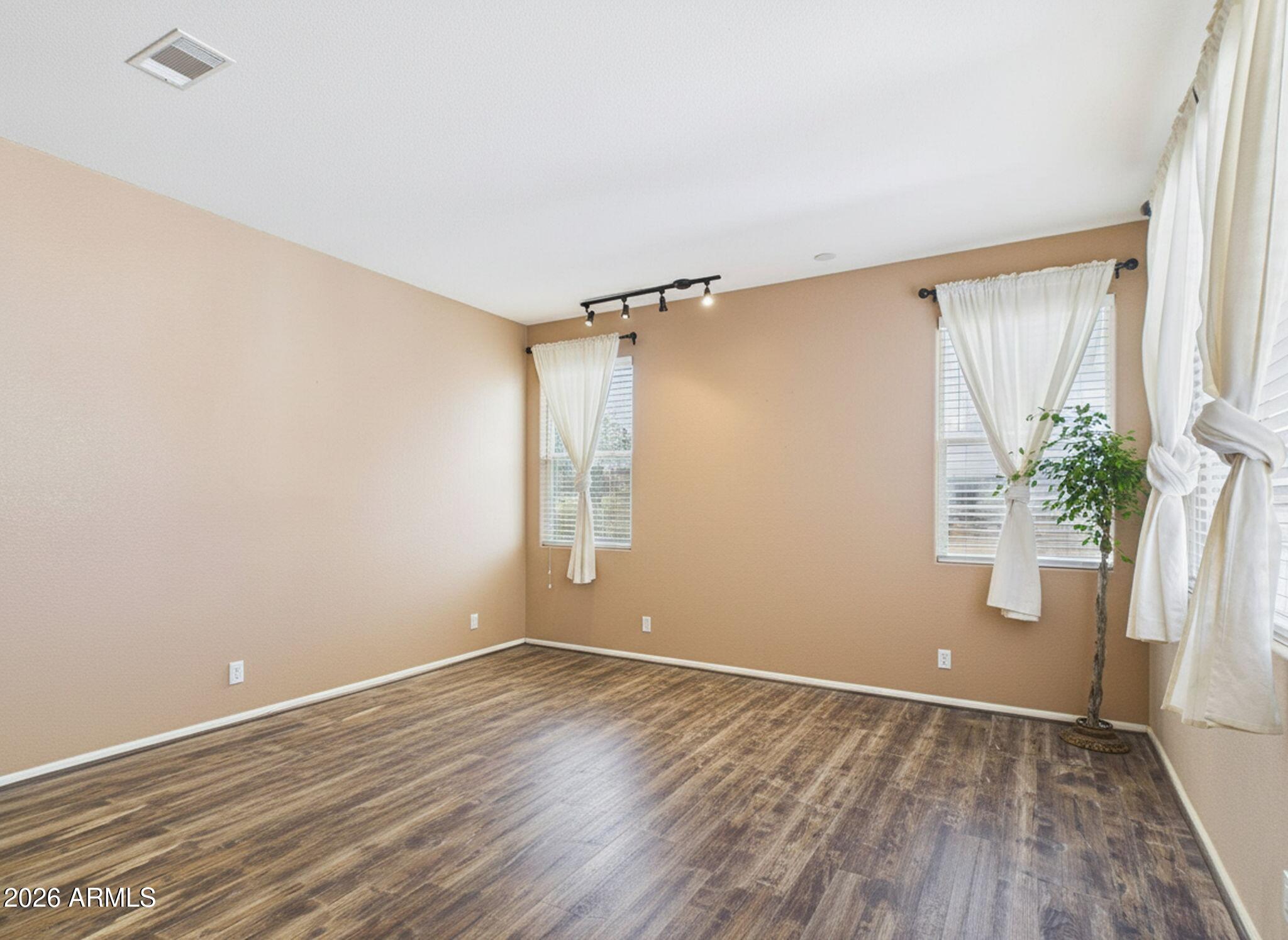 51491 West Dune Shadow Road Maricopa, AZ 85139 - Photo 4 of 33 wooden floor in an empty room