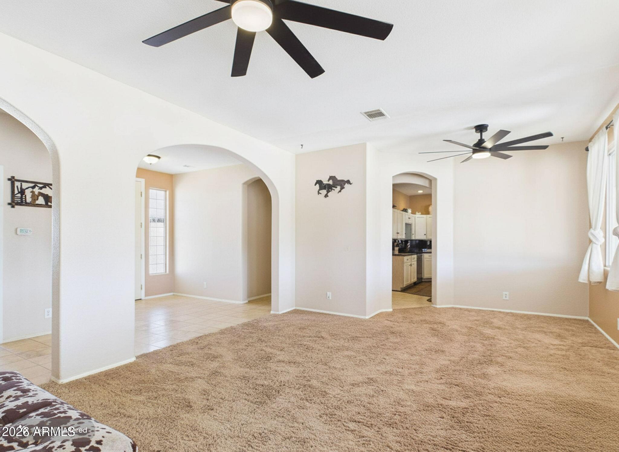 51491 West Dune Shadow Road Maricopa, AZ 85139 - Photo 5 of 33 a view of a room with closet and wooden floor