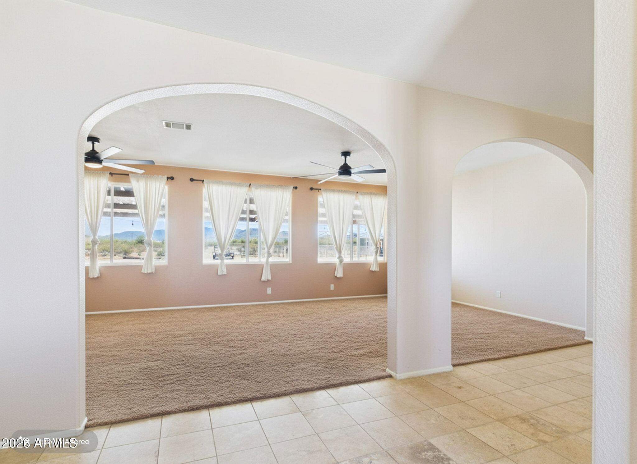 51491 West Dune Shadow Road Maricopa, AZ 85139 - Photo 8 of 33 a view of room with window and hallway