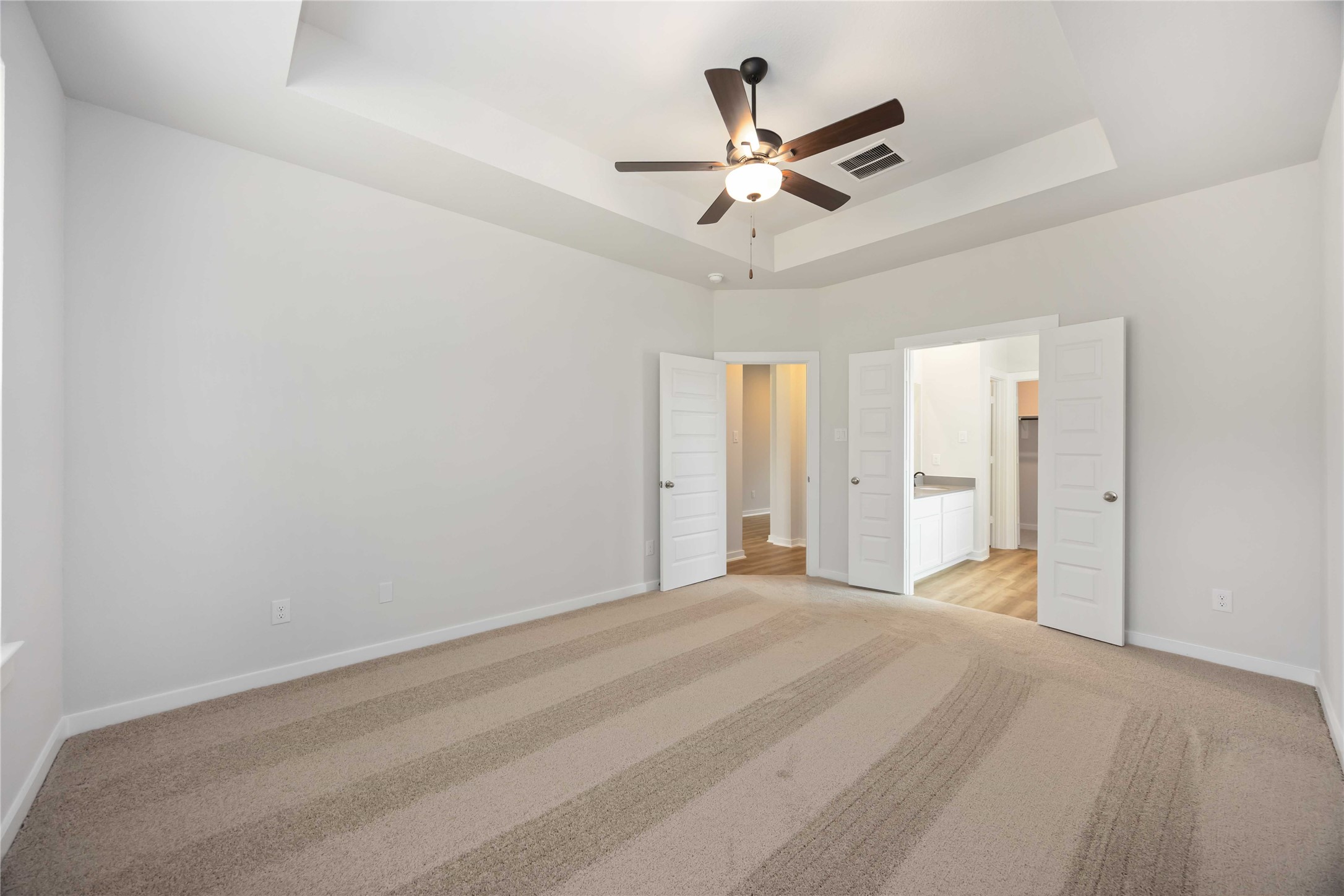 13511 Caldwell Street Conroe, TX 77303 - Photo 12 of 29 a view of a livingroom with a ceiling fan with wooden floor