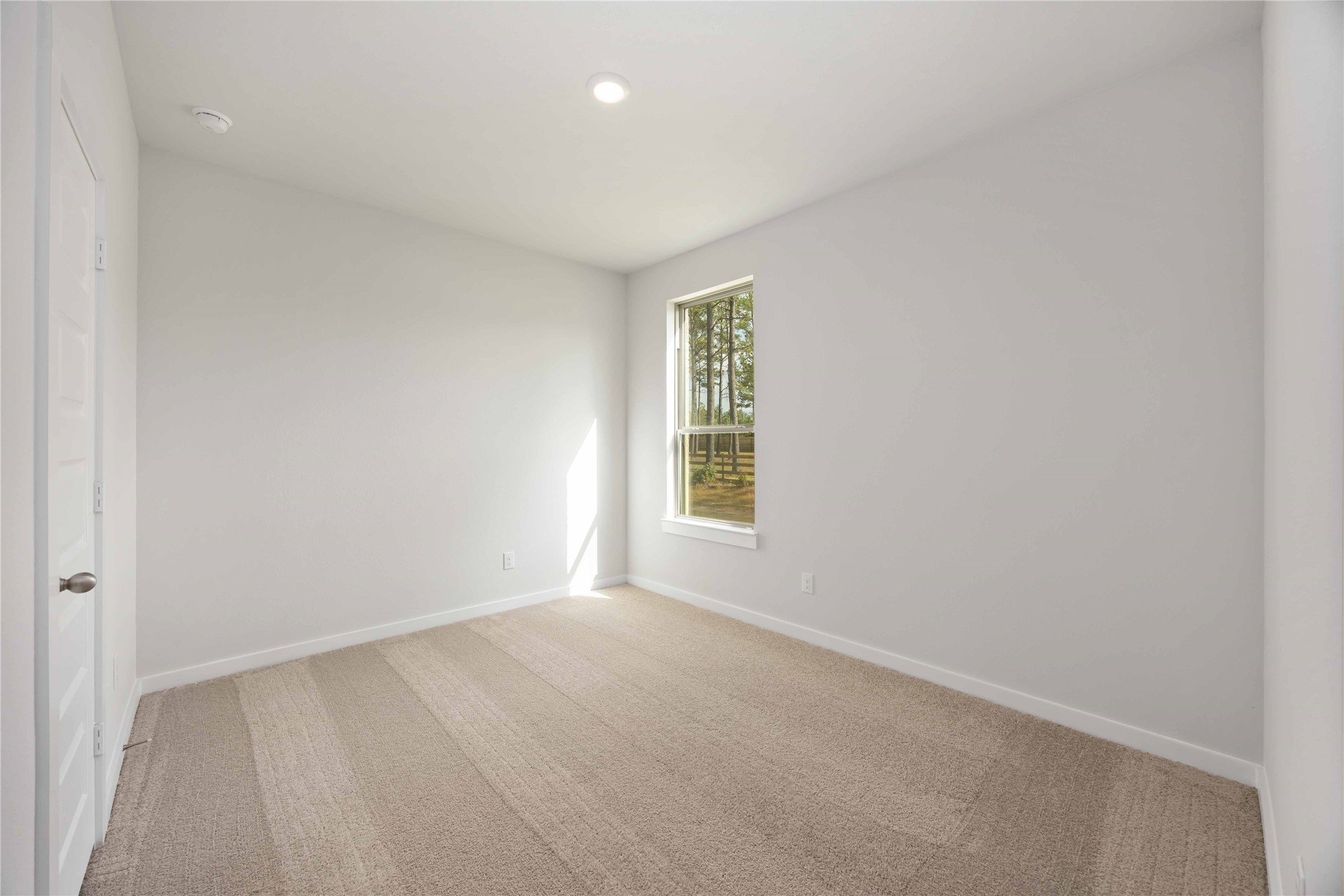 13511 Caldwell Street Conroe, TX 77303 - Photo 16 of 29 an empty room with a window