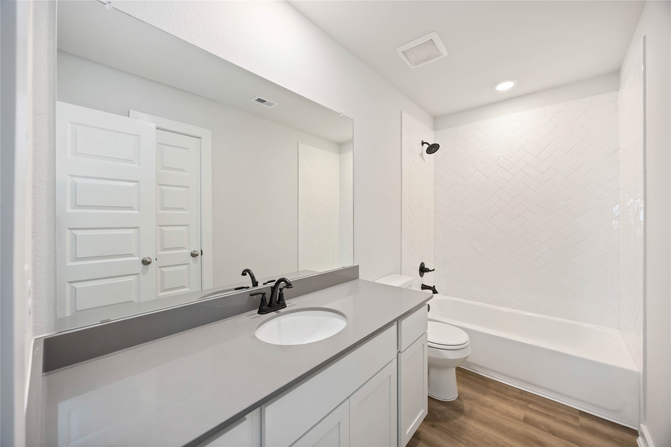 13511 Caldwell Street Conroe, TX 77303 - Photo 24 of 29 a bathroom with a granite countertop sink toilet and shower