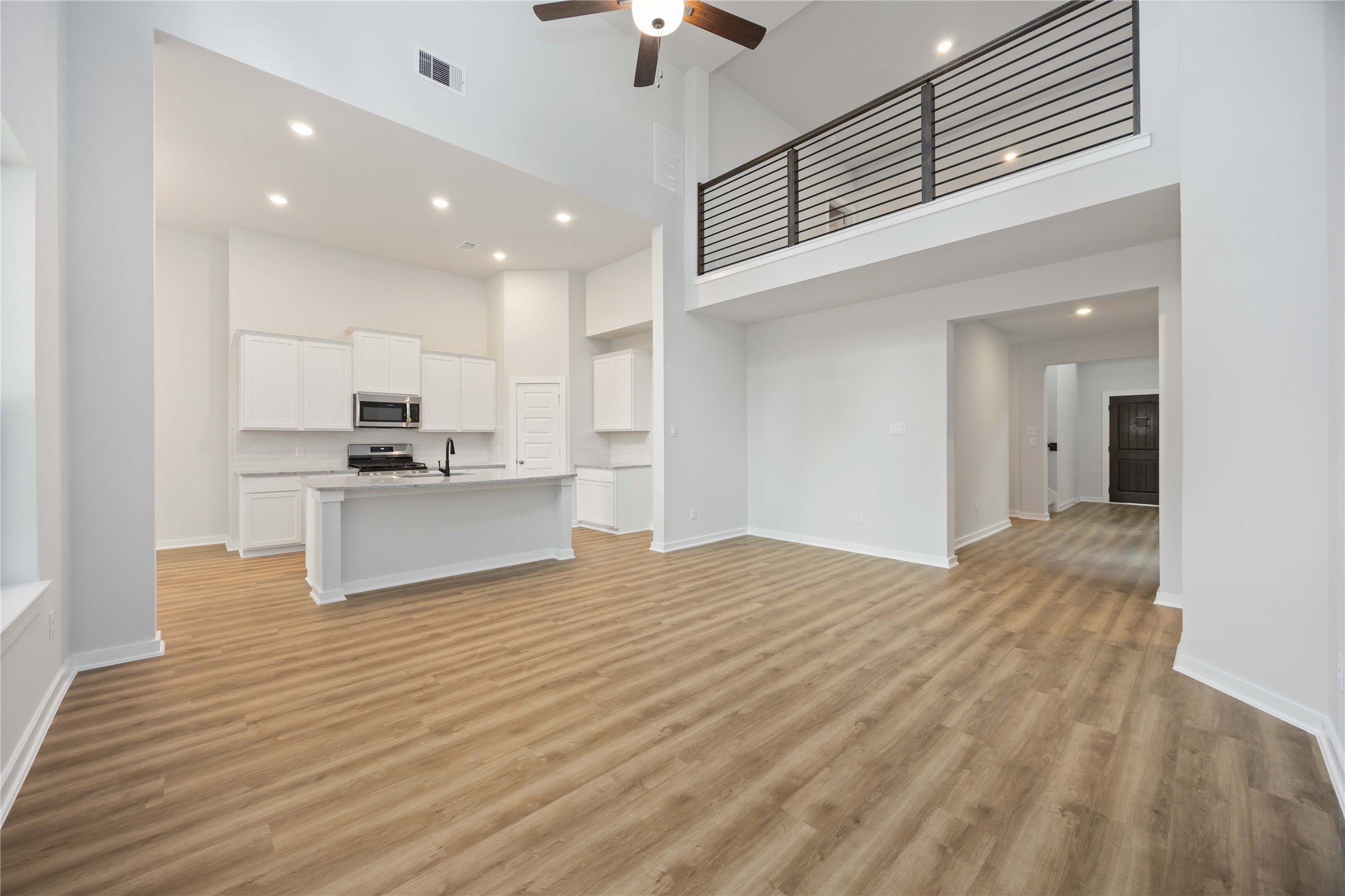 13511 Caldwell Street Conroe, TX 77303 - Photo 5 of 29 a view of kitchen with granite countertop cabinets and refrigerator