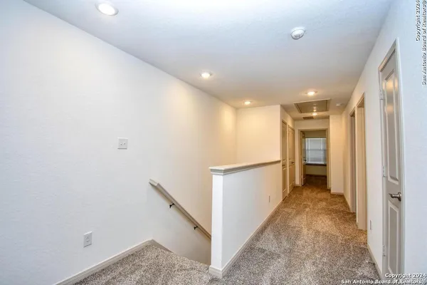 a view of hallway with stairs