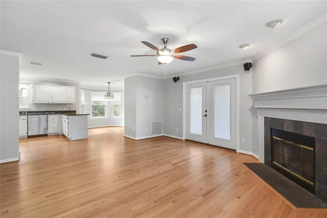 a view of an empty room with a kitchen and a kitchen