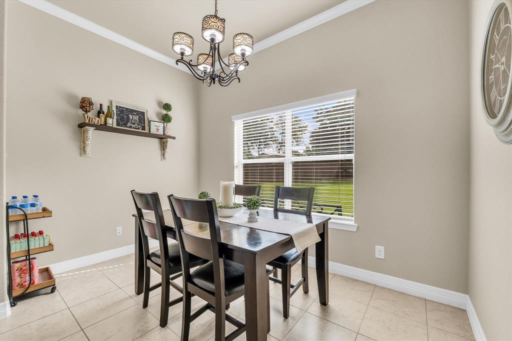 910 Springdale Lane Lorena, TX 76655 - Photo 12 of 39 Neutral-toned wall paint with white crown molding and baseboards