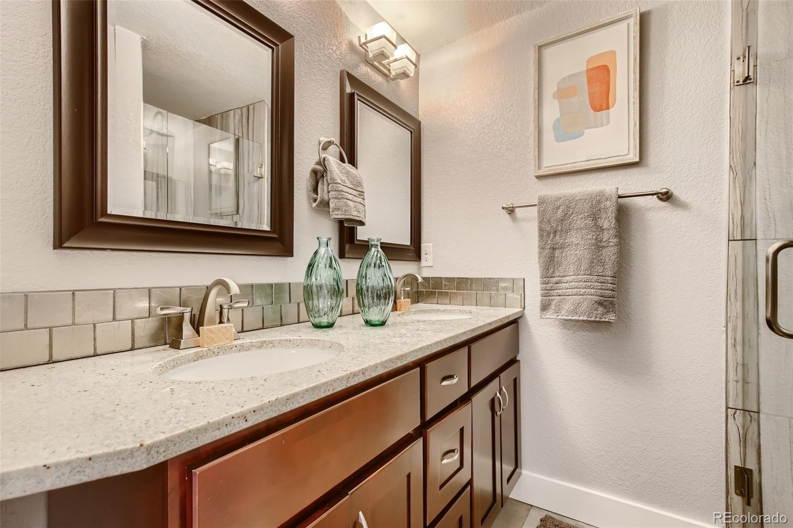 2310 South Decatur Street Denver, CO 80219 - Photo 13 of 27 a bathroom with a granite countertop sink and a mirror