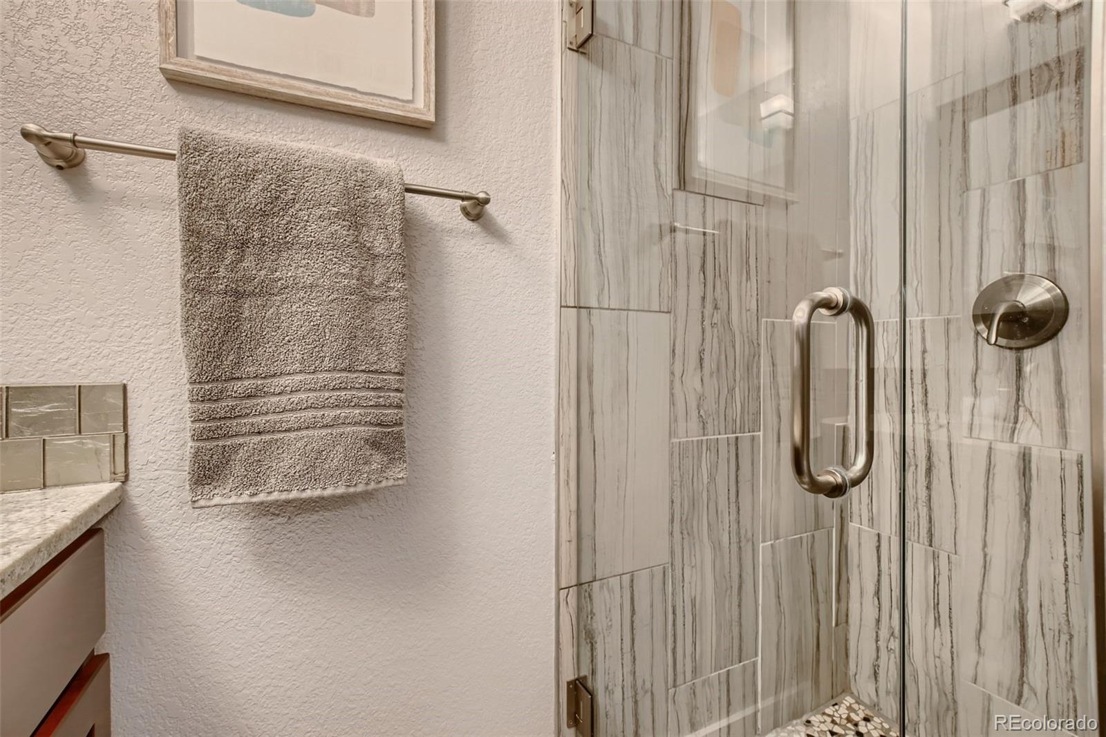 2310 South Decatur Street Denver, CO 80219 - Photo 14 of 27 a bathroom with a shower