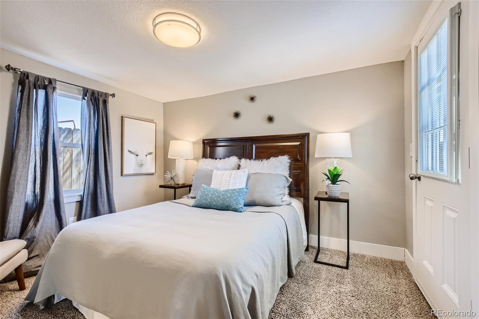 2310 South Decatur Street Denver, CO 80219 - Photo 17 of 27 a bedroom with a bed and a window