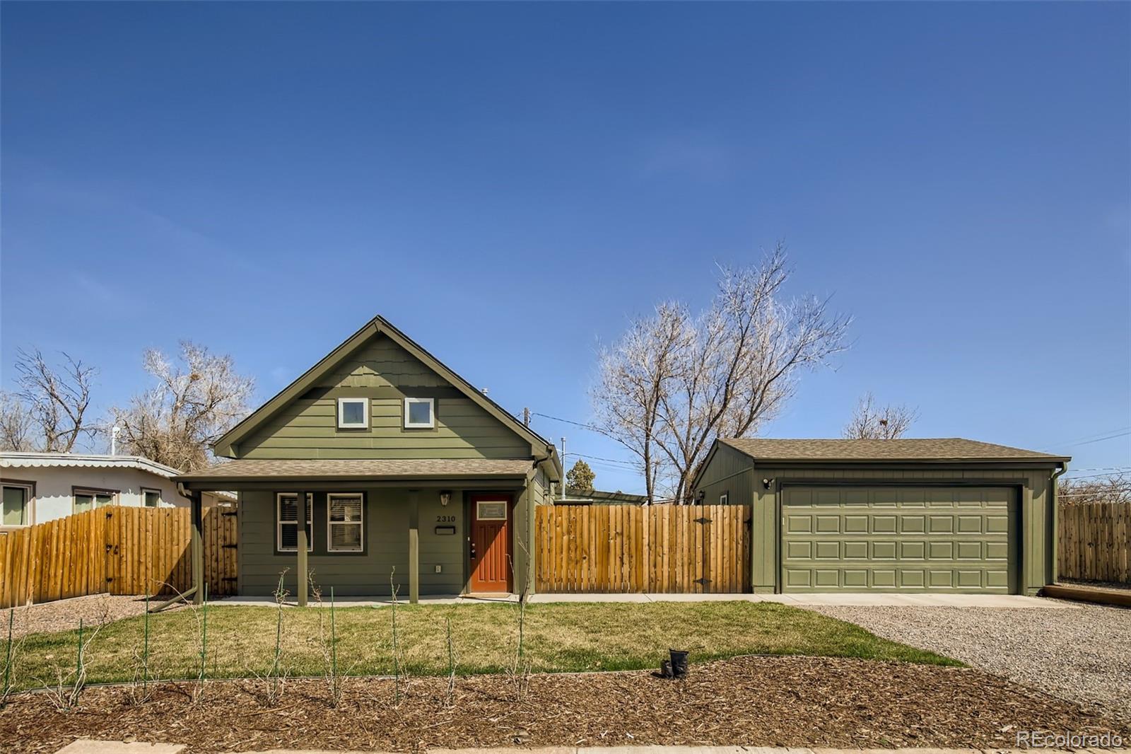 2310 South Decatur Street Denver, CO 80219 - Photo 2 of 27 a front view of a house with garden