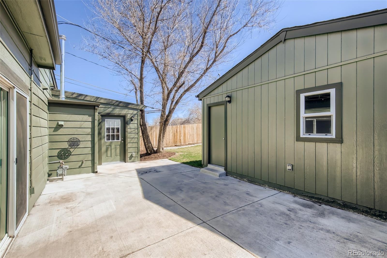 2310 South Decatur Street Denver, CO 80219 - Photo 22 of 27 a view of a house with a large tree