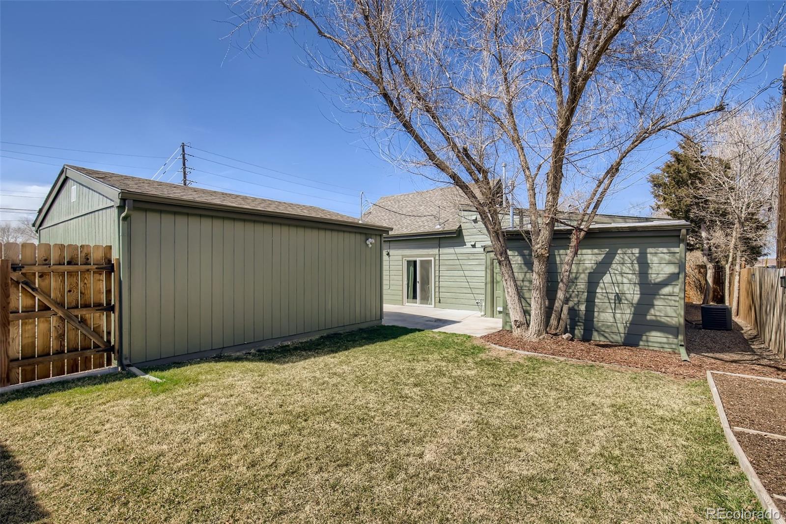 2310 South Decatur Street Denver, CO 80219 - Photo 23 of 27 a view of a house with a yard