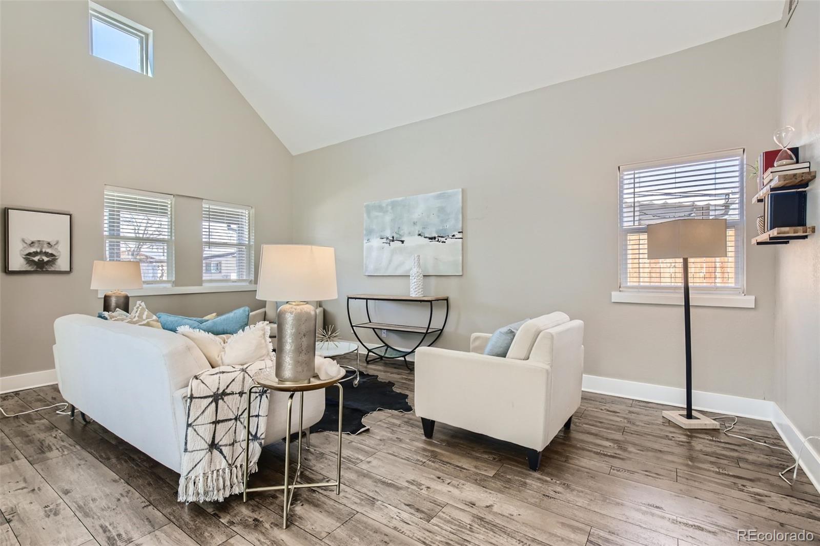 2310 South Decatur Street Denver, CO 80219 - Photo 5 of 27 a living room with furniture and a wooden floor