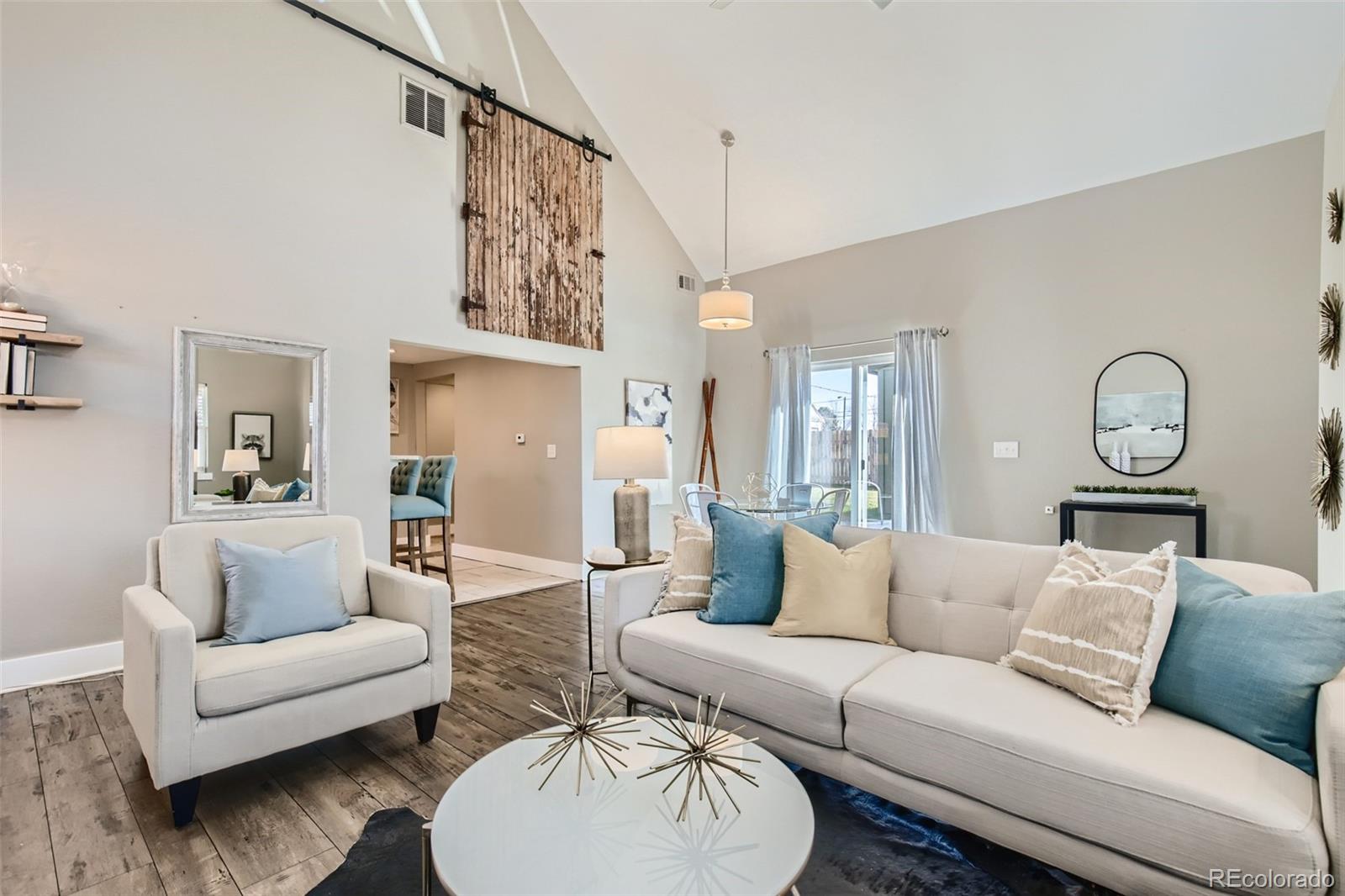 2310 South Decatur Street Denver, CO 80219 - Photo 6 of 27 a living room with furniture and a large window