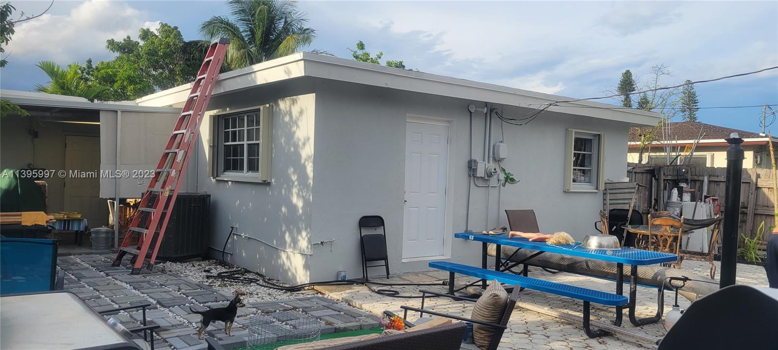 Sunray West North Miami Beach, FL 33162 - Photo 2 of 6 a front view of a house with patio
