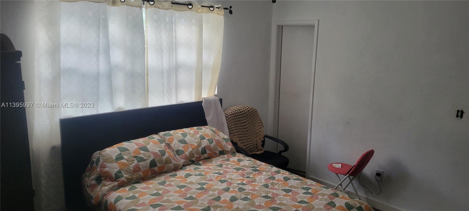 Sunray West North Miami Beach, FL 33162 - Photo 6 of 6 a bedroom with a bed and a window