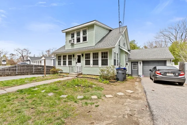 a view of a house with swimming pool and sitting area