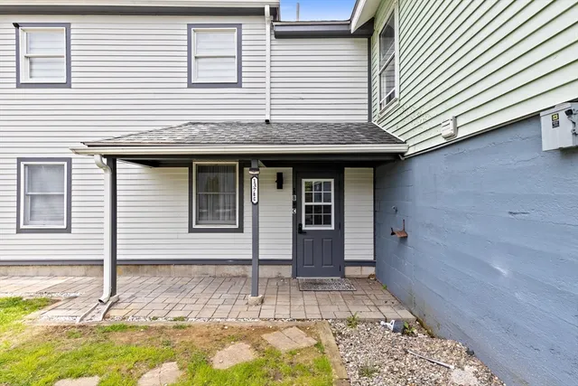 a view of a house with a yard and wooden floor and fence
