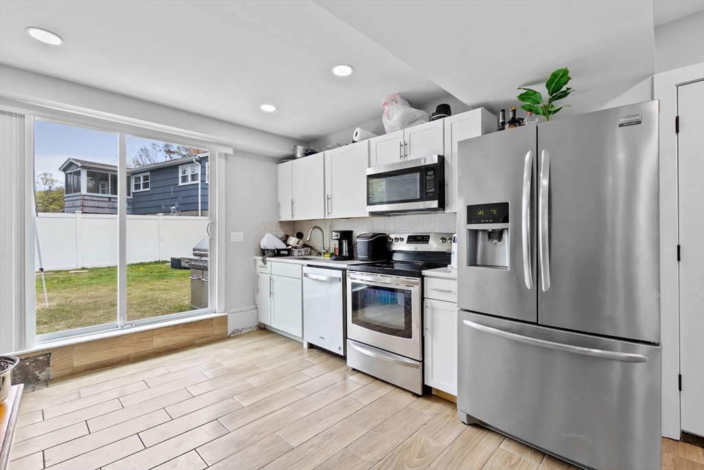 137 Westboro Road North Grafton, MA 01536 - Photo 2 of 36 a kitchen with stainless steel appliances a refrigerator sink and microwave