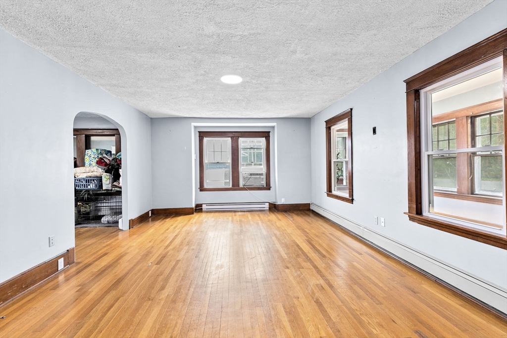 137 Westboro Road North Grafton, MA 01536 - Photo 25 of 36 a view of an empty room with wooden floor and a window