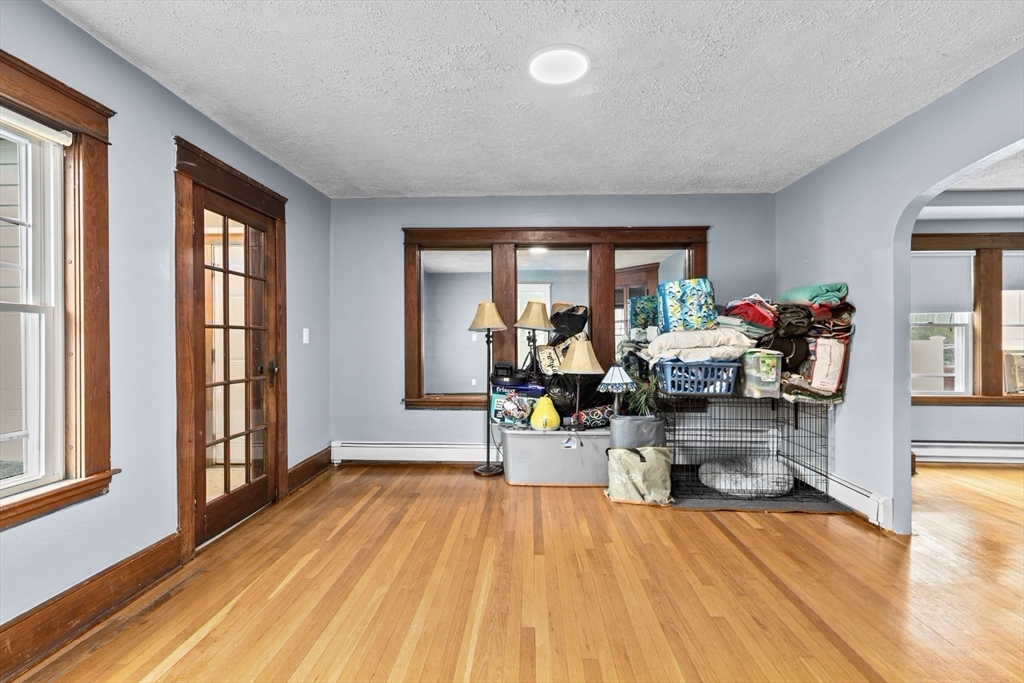 137 Westboro Road North Grafton, MA 01536 - Photo 29 of 36 a living room filled with furniture and a wooden floor