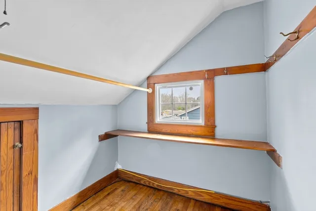 a view of a room with window and wooden floor