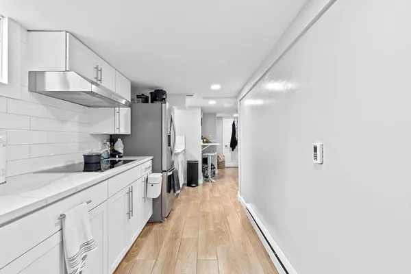 a large kitchen with cabinets