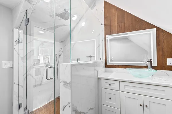 a bathroom with a bathtub and a shower