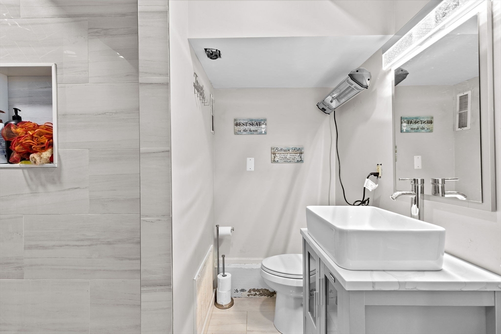 137 Westboro Road North Grafton, MA 01536 - Photo 9 of 36 a bathroom with a sink toilet and shower