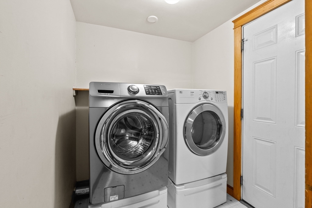 137 Westboro Road North Grafton, MA 01536 - Photo 10 of 36 a utility room with dryer and washer