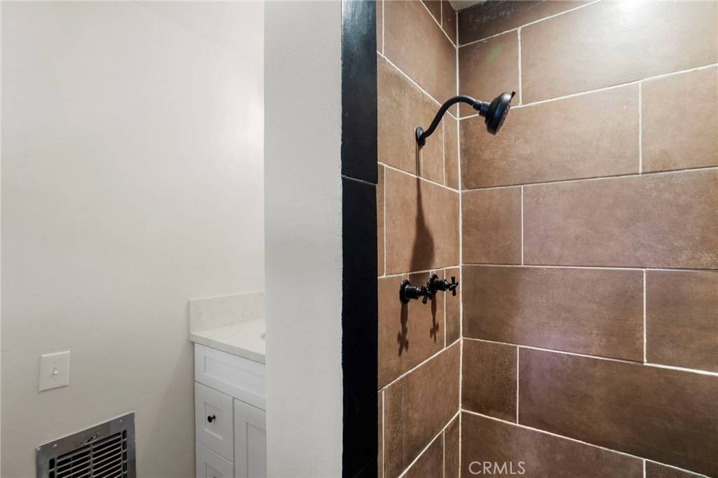 812 Bergschrund Drive Crestline, CA 92325 - Photo 14 of 23 a bathroom with a shower and a mirror