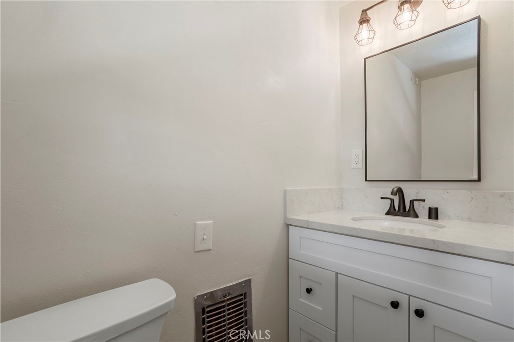 812 Bergschrund Drive Crestline, CA 92325 - Photo 15 of 23 a bathroom with a toilet sink and mirror