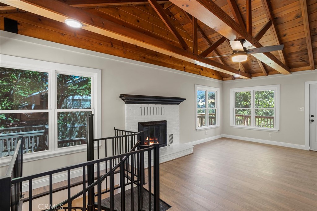 812 Bergschrund Drive Crestline, CA 92325 - Photo 16 of 23 a view of livingroom with furniture fireplace and windows