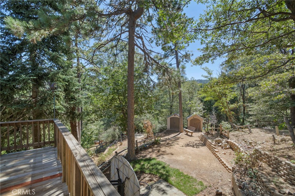 812 Bergschrund Drive Crestline, CA 92325 - Photo 19 of 23 a view of backyard with table and chairs and wooden fence