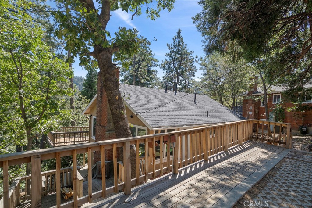 812 Bergschrund Drive Crestline, CA 92325 - Photo 21 of 23 a view of balcony with wooden fence and trees