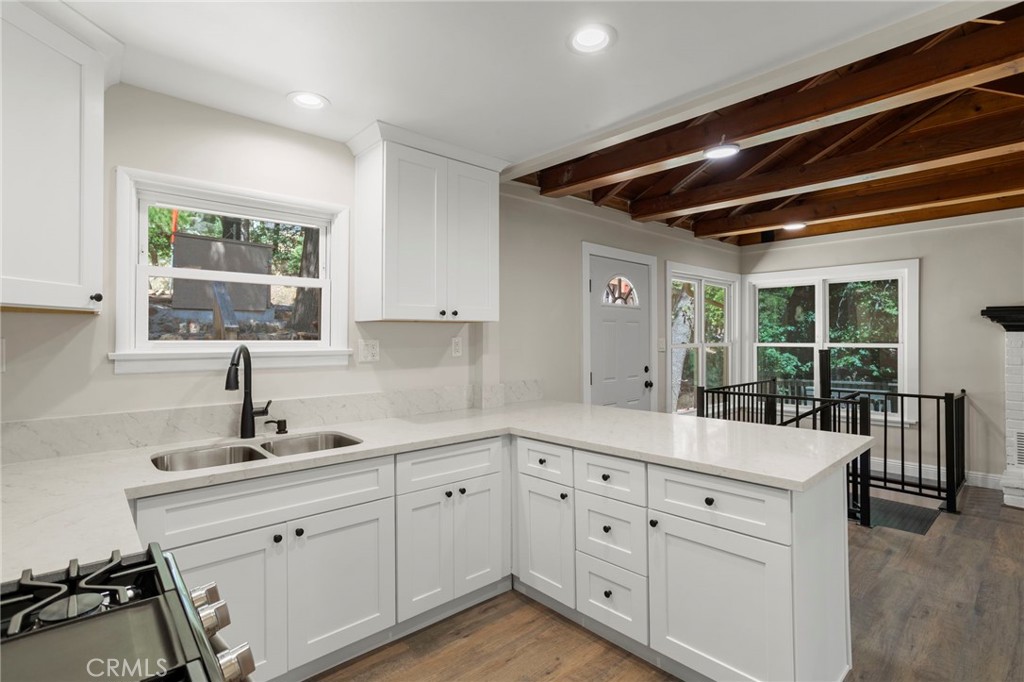 812 Bergschrund Drive Crestline, CA 92325 - Photo 7 of 23 a kitchen with cabinets a sink and appliances