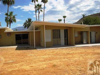 72140 Rancho Road Rancho Mirage, CA 92270 - Photo 5 of 13 a front view of a house with a yard