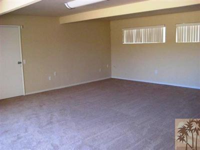 72140 Rancho Road Rancho Mirage, CA 92270 - Photo 8 of 13 a view of an empty room with a window