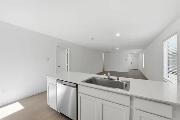a kitchen with a sink and cabinets