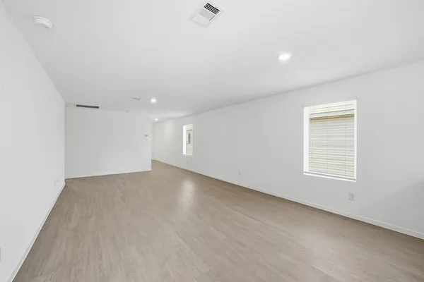 an empty room with a empty space and window