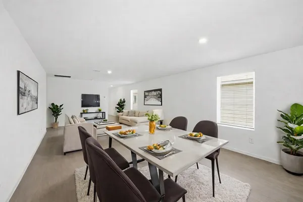 a view of a dining room with furniture window and outside view