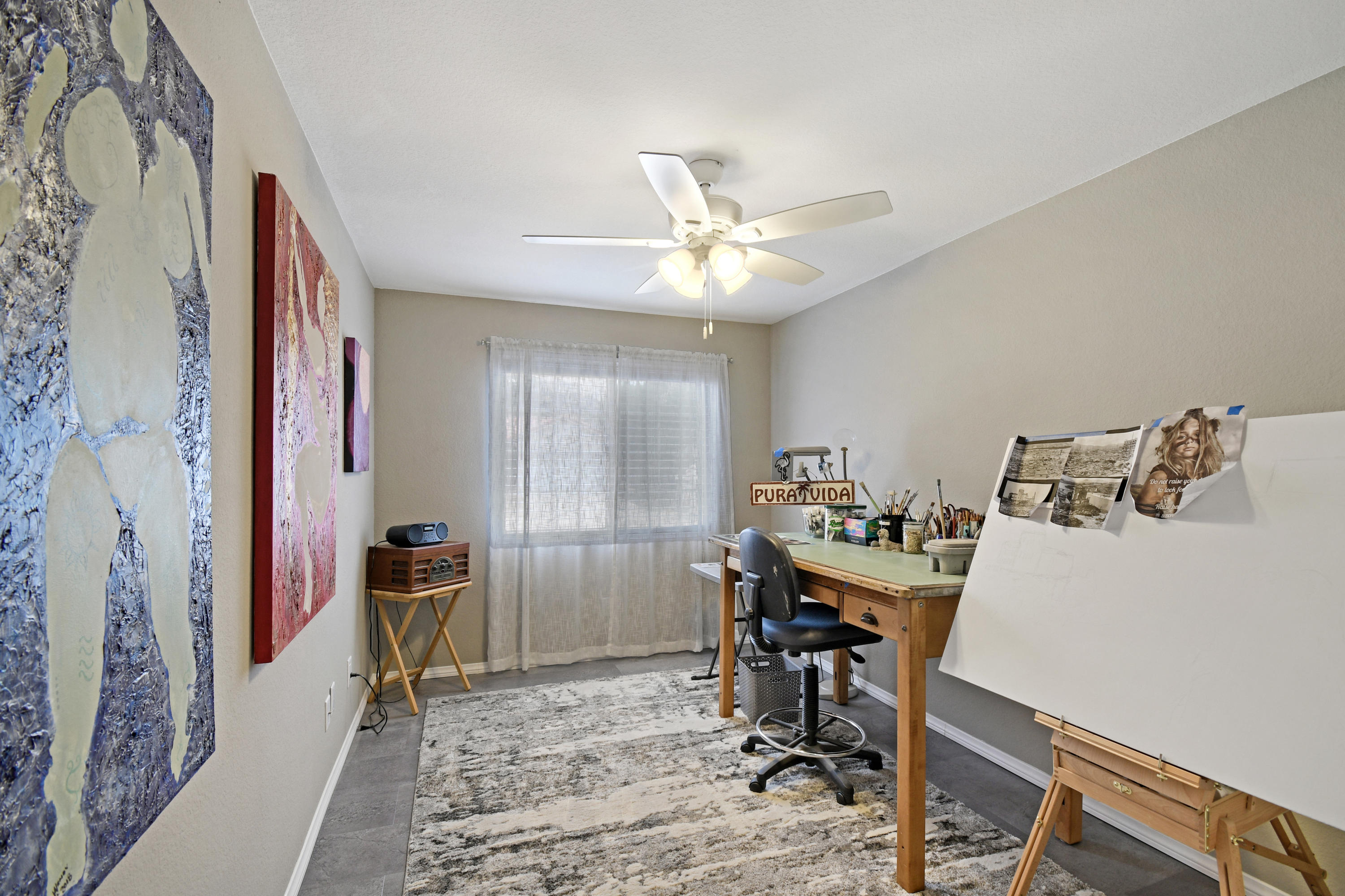 3129 Quarry Road Palmdale, CA 93550 - Photo 14 of 19 a view of a workspace with furniture and a livingroom